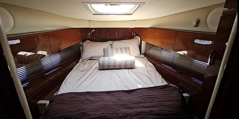 Slide: The Image of Luxurious cabin interior of 2016 Sea Ray 470 Sundancer yacht with plush bedding. - 20