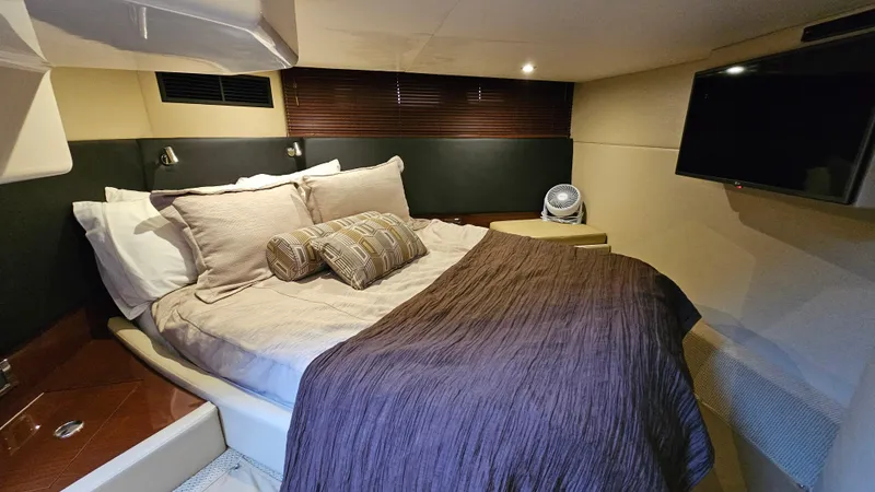 Slide: The Image of Luxurious cabin interior of 2016 Sea Ray 470 Sundancer with cozy bed and modern decor. - 24
