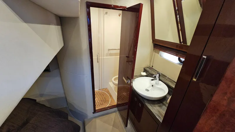 Slide: The Image of Luxurious bathroom interior of 2016 Sea Ray 470 Sundancer yacht, featuring modern sink and shower. - 26