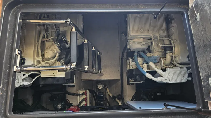 Slide: The Image of Engine compartment of a 2016 Sea Ray 470 Sundancer boat, showcasing dual engines. - 32