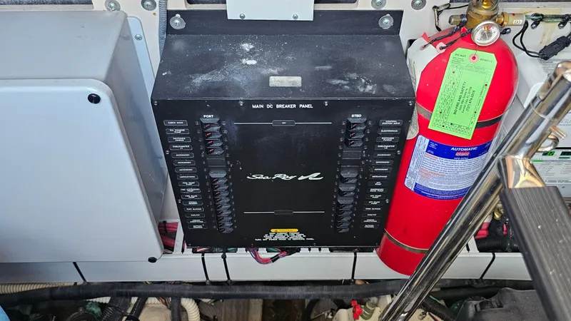 Slide: The Image of Electrical panel and fire extinguisher on a 2016 Sea Ray 470 Sundancer yacht. - 35