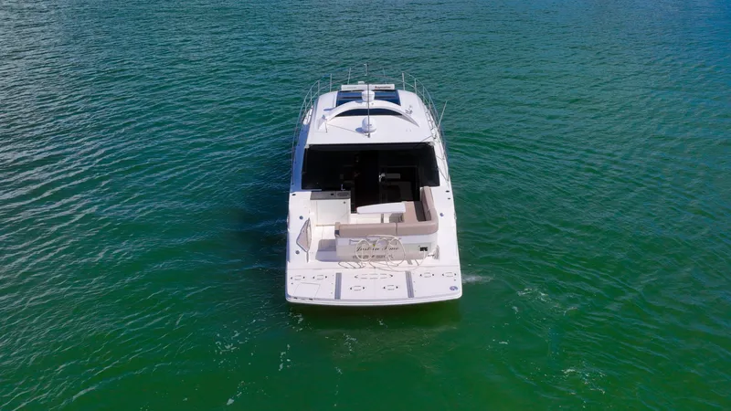 Slide: The Image of 2016 Sea Ray 470 Sundancer yacht on open water, aerial view. - 4