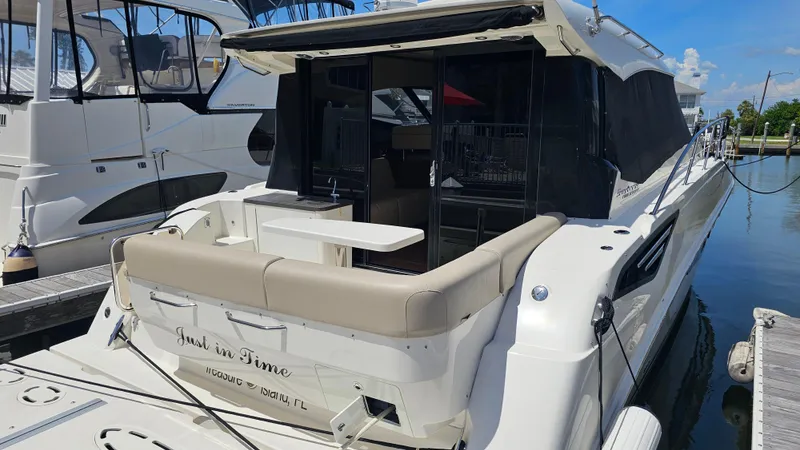 Slide: The Image of 2016 Sea Ray 470 Sundancer yacht docked at marina, featuring spacious outdoor seating. - 41