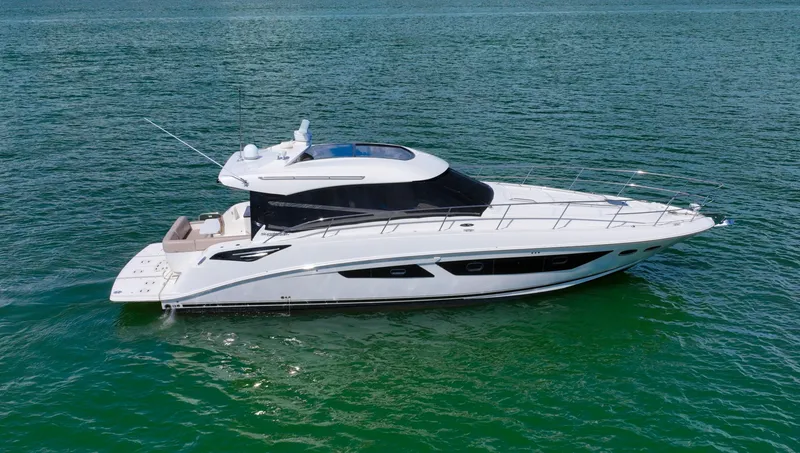 Slide: The Image of 2016 Sea Ray 470 Sundancer yacht cruising on open water. - 6