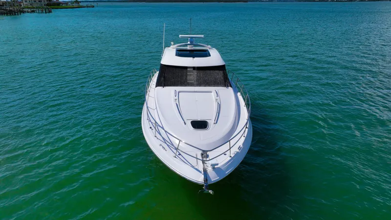 Slide: The Image of 2016 Sea Ray 470 Sundancer yacht on clear blue water. - 8