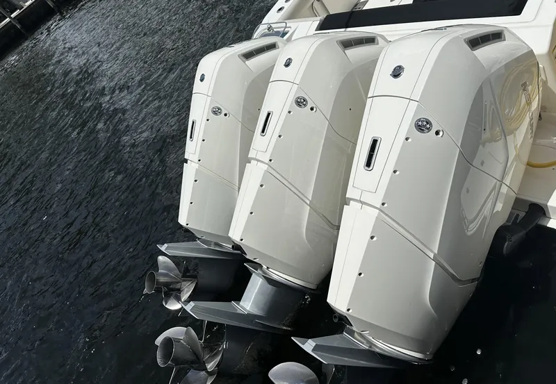 Slide: The Image of Triple outboard engines on a 2022 Boston Whaler 405 Conquest boat. - 20
