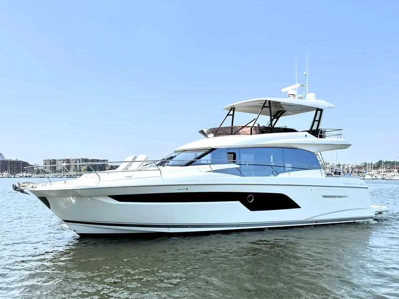 Slide: The Image of 2022 Prestige 520 yacht on calm water, showcasing sleek design and modern features. - 0