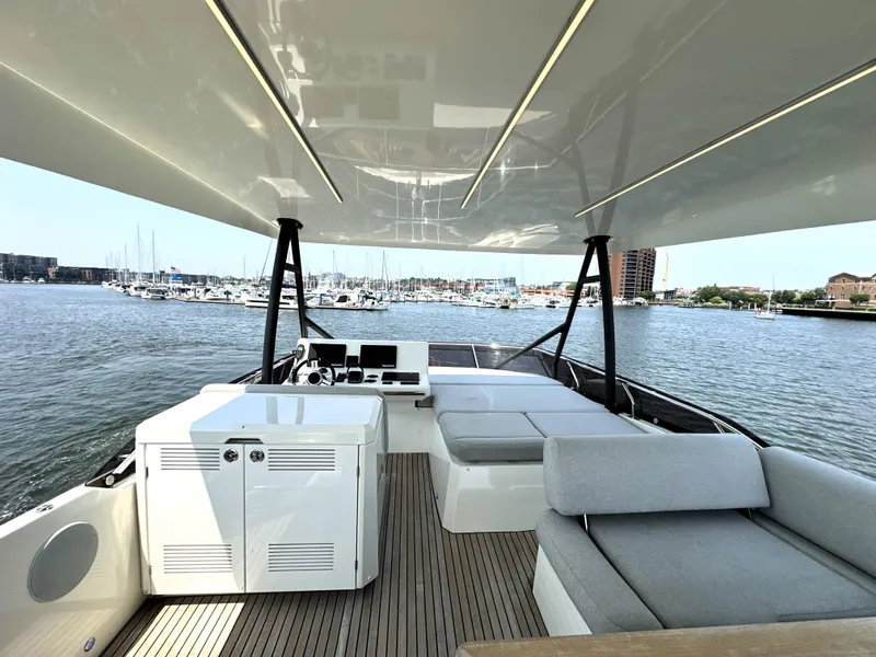 Slide: The Image of Luxurious 2022 Prestige 520 yacht interior with spacious seating and scenic marina view. - 1