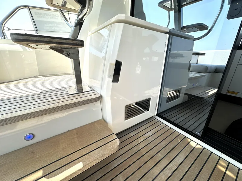 Slide: The Image of Prestige 520 yacht interior, 2022 model, featuring sleek design and wooden flooring. - 10