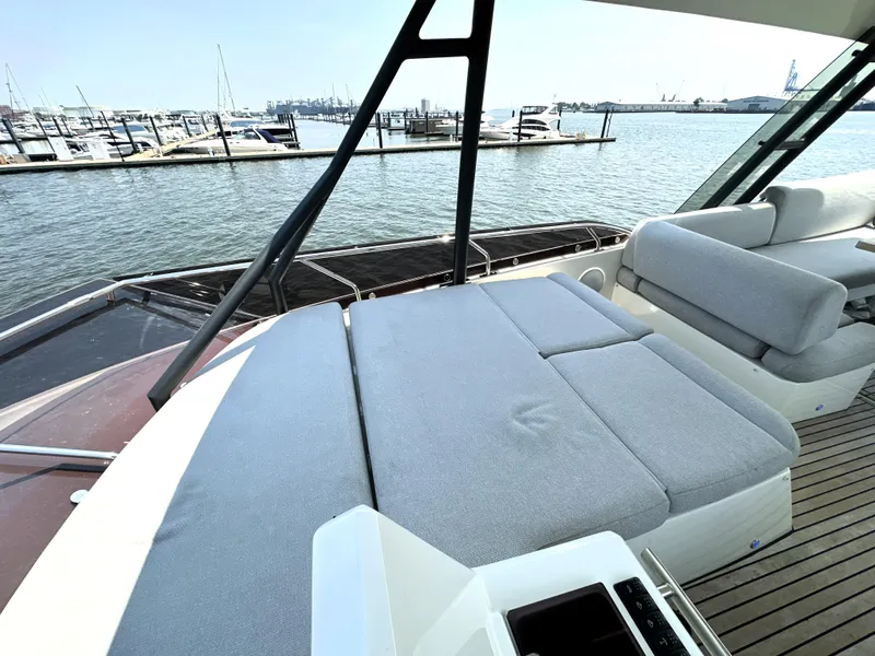 Slide: The Image of Prestige 520 yacht 2022 model with spacious deck and marina view. - 20