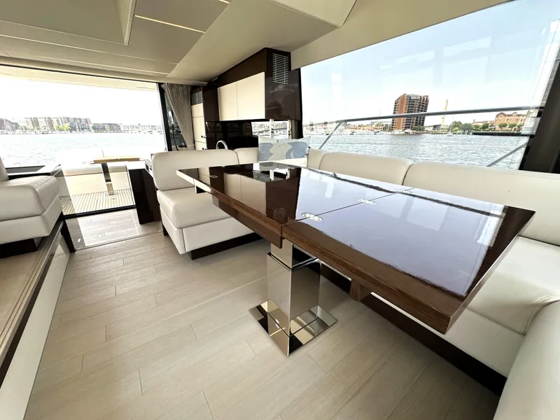 Slide: The Image of Luxurious interior of 2022 Prestige 520 yacht with elegant dining area and waterfront view. - 33