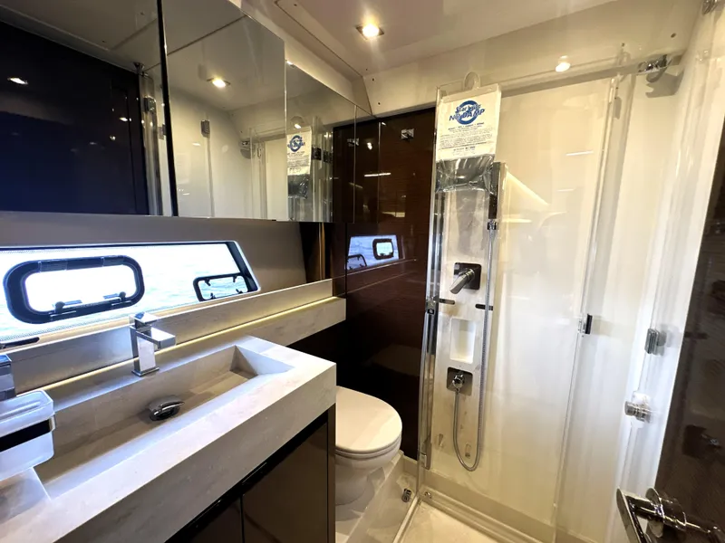 Slide: The Image of Luxurious bathroom in 2022 Prestige 520 yacht with modern fixtures and glass shower. - 45