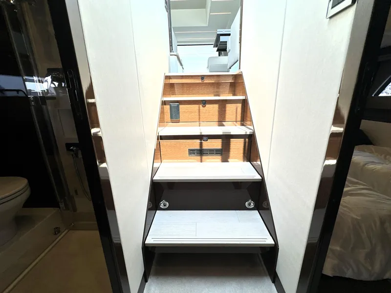 Slide: The Image of Staircase inside 2022 Prestige 520 yacht, leading to upper deck, modern interior design. - 47