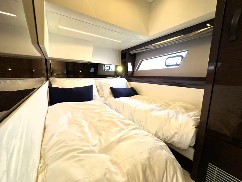 Slide: The Image of Luxurious cabin interior of 2022 Prestige 520 yacht with twin beds and modern design. - 49