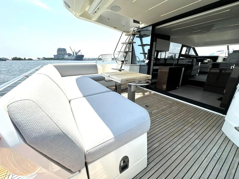 Slide: The Image of Luxury 2022 Prestige 520 yacht with spacious deck and modern interior design. - 6
