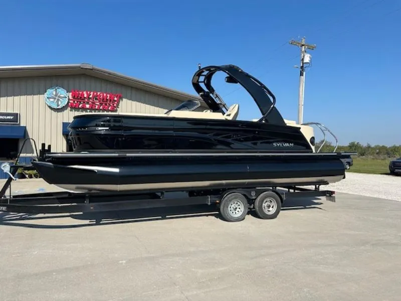 The Image of 2025 Sylvan G-3 CLZ DC pontoon boat on trailer, parked outside dealership. - 0