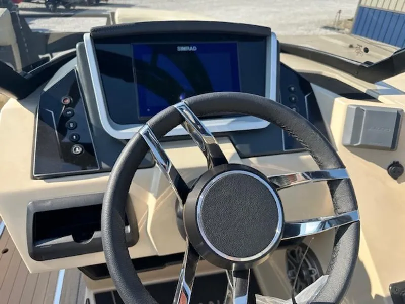 Slide: The Image of Steering wheel and dashboard of 2025 Sylvan G-3 CLZ DC boat. - 11