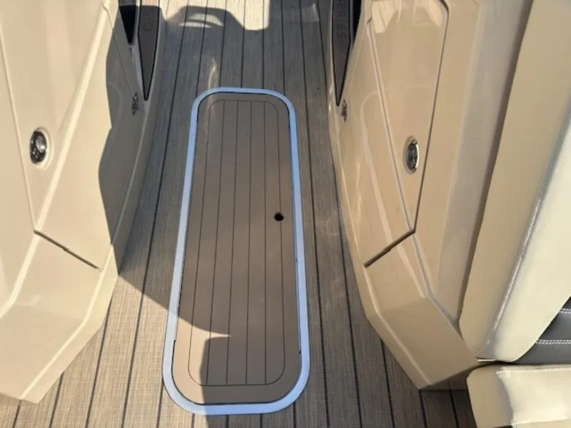 Slide: The Image of 2025 Sylvan G-3 CLZ DC boat deck with sleek, modern design and storage compartment. - 14