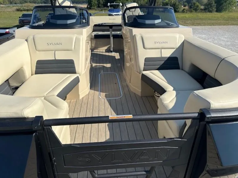 Slide: The Image of 2025 Sylvan G-3 CLZ DC boat interior with beige seating and sleek design. - 16