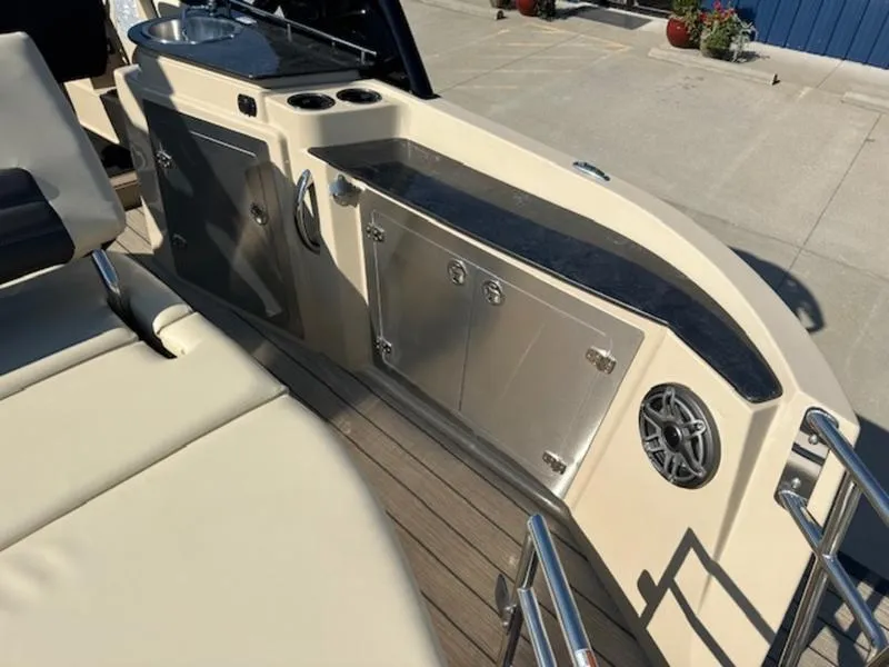 Slide: The Image of 2025 Sylvan G-3 CLZ DC boat interior with sleek cabinetry and modern amenities. - 4