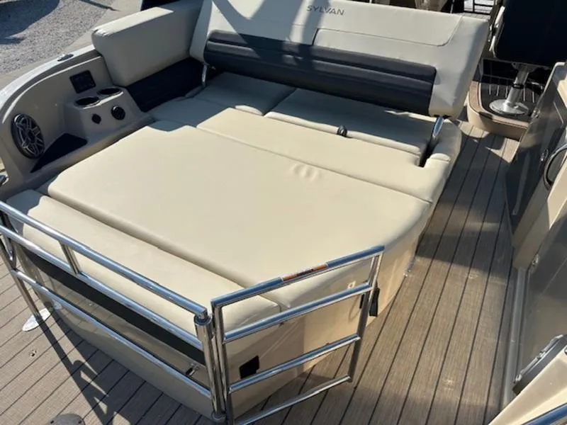 Slide: The Image of 2025 Sylvan G-3 CLZ DC boat with spacious beige seating and sleek metal railings. - 5