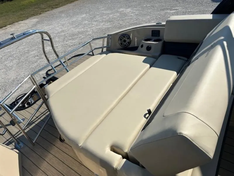 Slide: The Image of 2025 Sylvan G-3 CLZ DC boat with beige seating and deck view. - 7