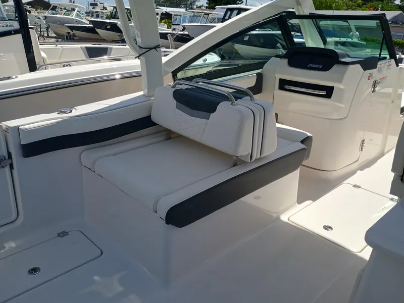 Slide: The Image of 2025 Robalo R257 Dual Console boat interior with sleek seating and modern design. - 21