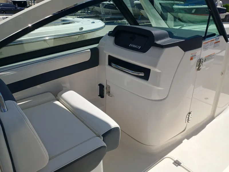 Slide: The Image of 2025 Robalo R257 Dual Console interior with sleek seating and modern design. - 24