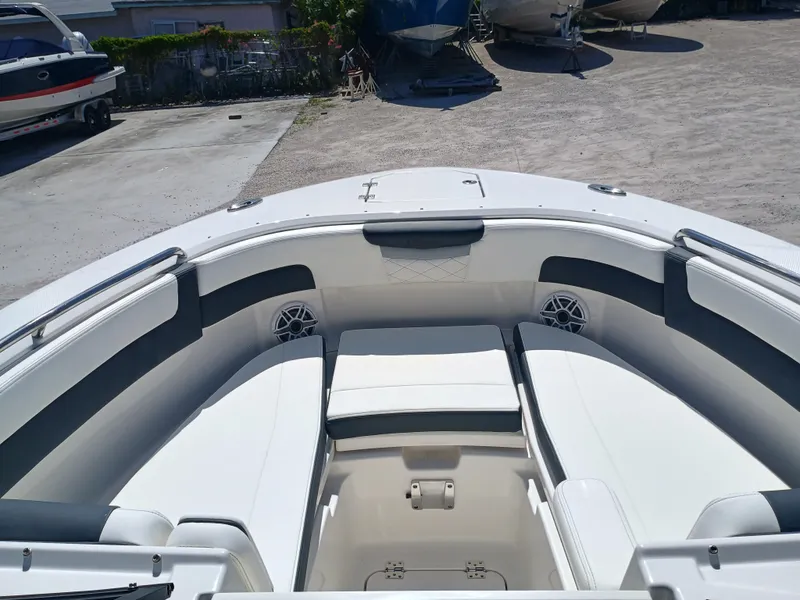Slide: The Image of 2025 Robalo R257 Dual Console boat interior with spacious seating and modern design. - 31