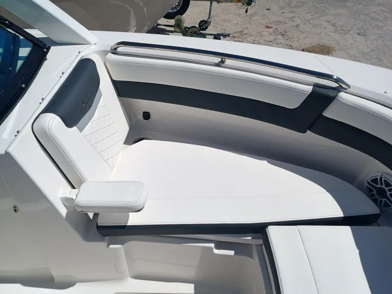Slide: The Image of 2025 Robalo R257 Dual Console boat interior with white seating and modern design. - 33