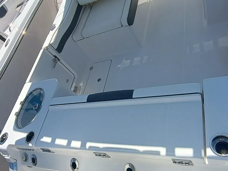 Slide: The Image of 2025 Robalo R257 Dual Console boat interior with seating and storage compartments. - 5