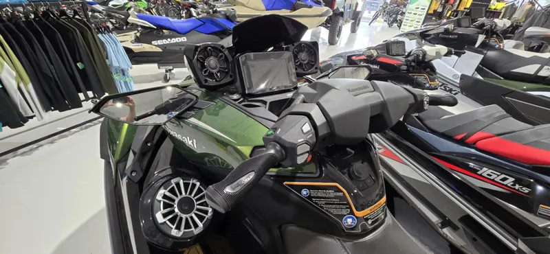 Slide: The Image of 2025 Kawasaki JetSki Ultra 160LX in showroom, featuring advanced dashboard and sleek design. - 5
