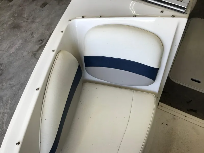 Slide: The Image of 2012 Stingray 195 RX boat seat with white and blue upholstery. - 11