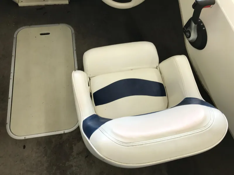Slide: The Image of 2012 Stingray 195 RX boat seat with blue and white upholstery. - 16