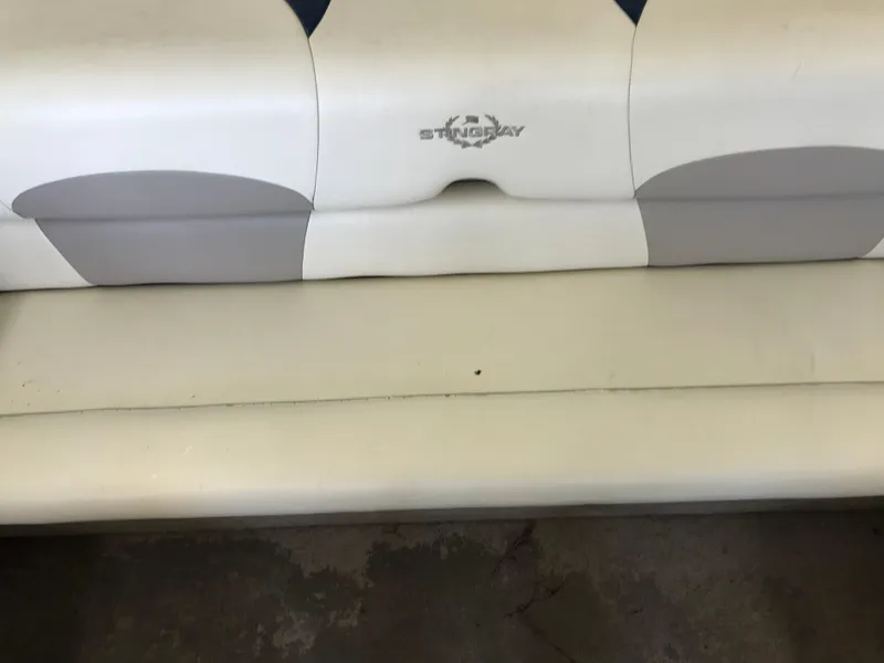 Slide: The Image of White and gray seating of a 2012 Stingray 195 RX boat. - 9