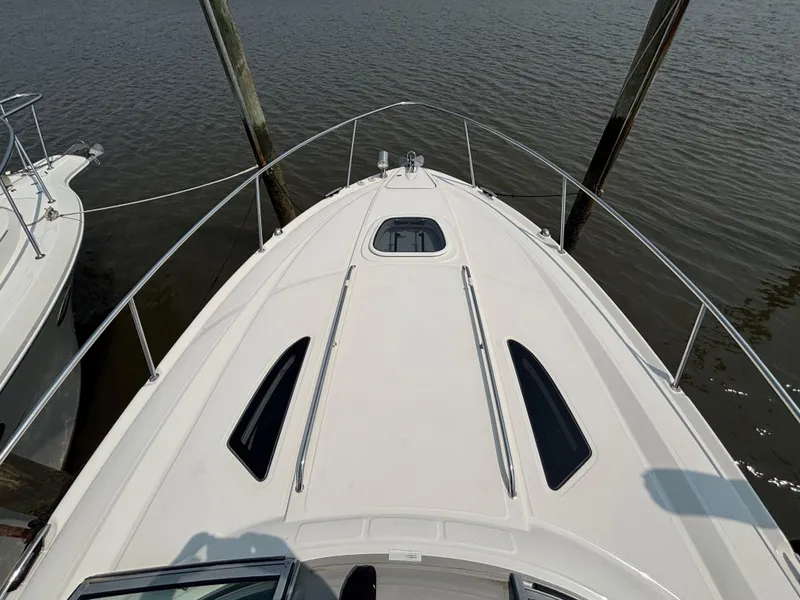 Slide: The Image of 2014 Sea Ray 330 Sundancer boat deck view at dock. - 15