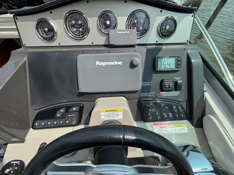 Slide: The Image of Control panel of 2014 Sea Ray 330 Sundancer with Raymarine navigation system. - 28