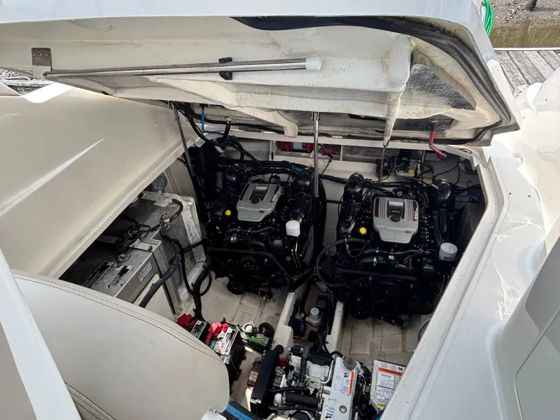 Slide: The Image of Engine compartment of a 2014 Sea Ray 330 Sundancer, showcasing dual engines and battery setup. - 5
