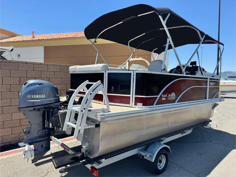 Slide: The Image of 2021 SunCatcher Select 18C pontoon boat with Yamaha motor on trailer. - 6
