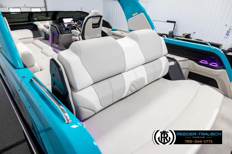Slide: The Image of 2025 Avalon 2585 Excal VRBW boat interior with white seating and modern dashboard. - 11