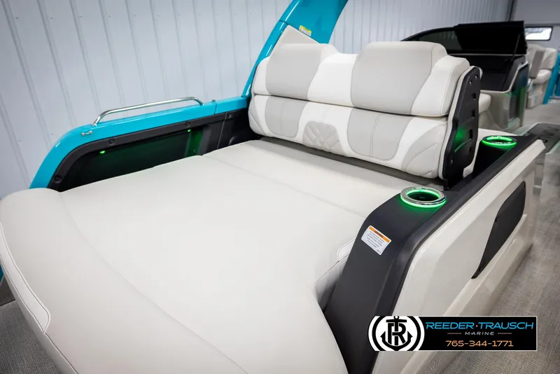 Slide: The Image of 2025 Avalon 2585 Excal VRBW boat interior with luxurious seating and cup holders. - 23