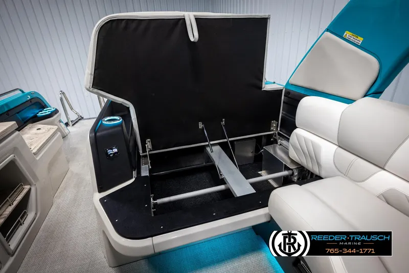 Slide: The Image of 2025 Avalon 2585 Excal VRBW boat interior with open storage compartment and seating. - 28