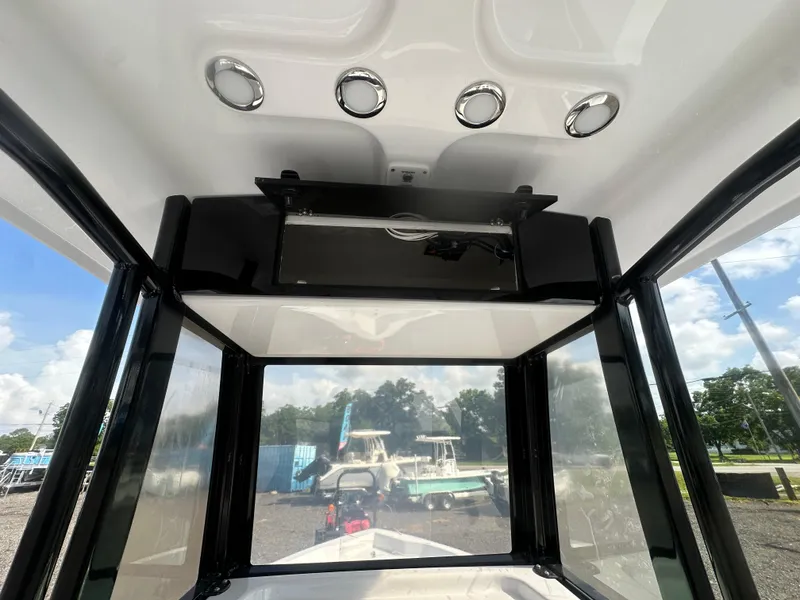 Slide: The Image of Interior view of 2026 Action Craft 24 Bay boat with sleek design and modern features. - 22