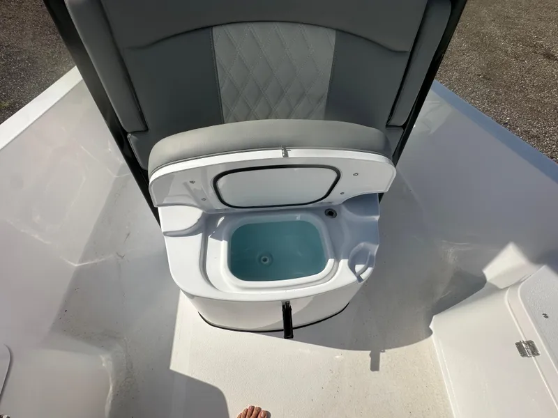 Slide: The Image of 2026 Action Craft 24 Bay boat with open livewell and cushioned seat. - 25