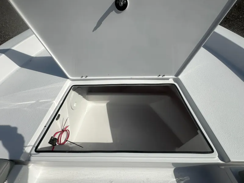 Slide: The Image of Open storage compartment on 2026 Action Craft 24 Bay boat. - 31