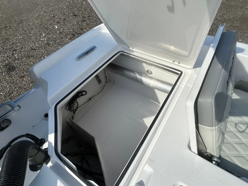 Slide: The Image of Open storage compartment on 2026 Action Craft 24 Bay boat, featuring sleek design and ample space. - 33