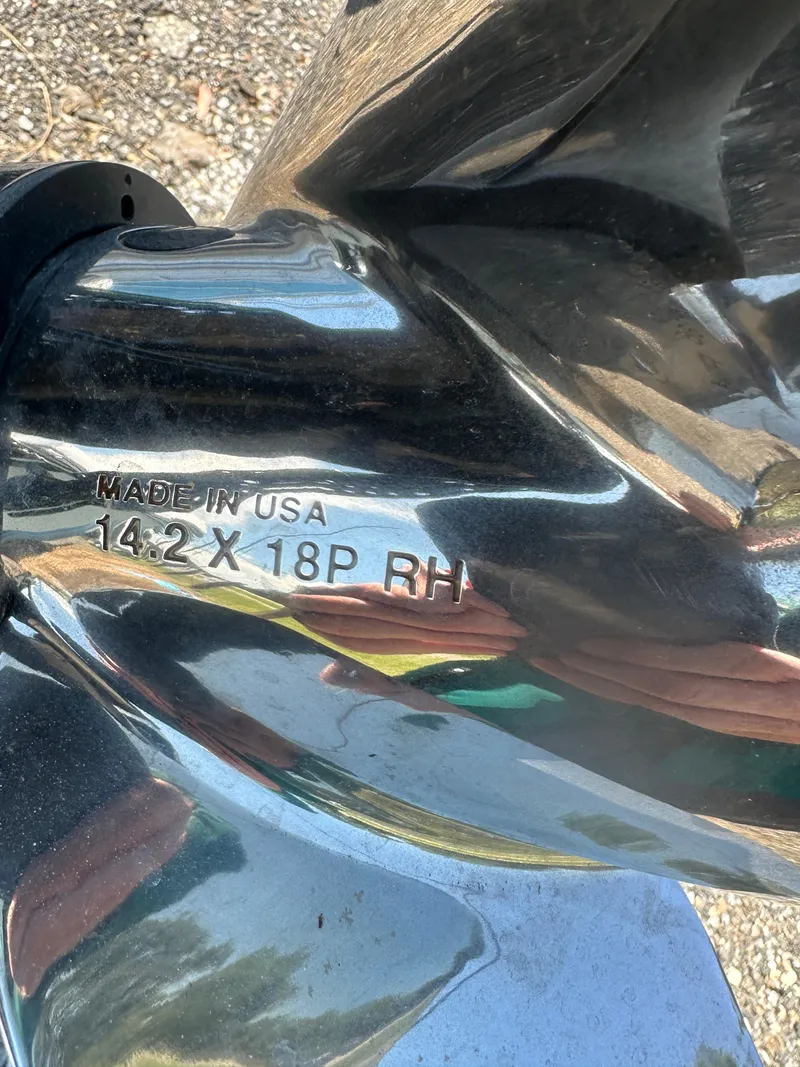 Slide: The Image of Close-up of a boat propeller with "Made in USA 14.2 x 18P RH" engraving. - 36