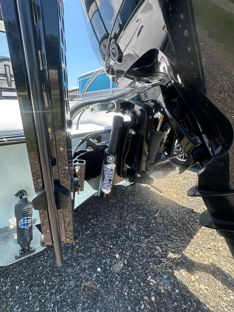 Slide: The Image of 2026 Action Craft 24 Bay boat engine and hydraulic system close-up. - 7