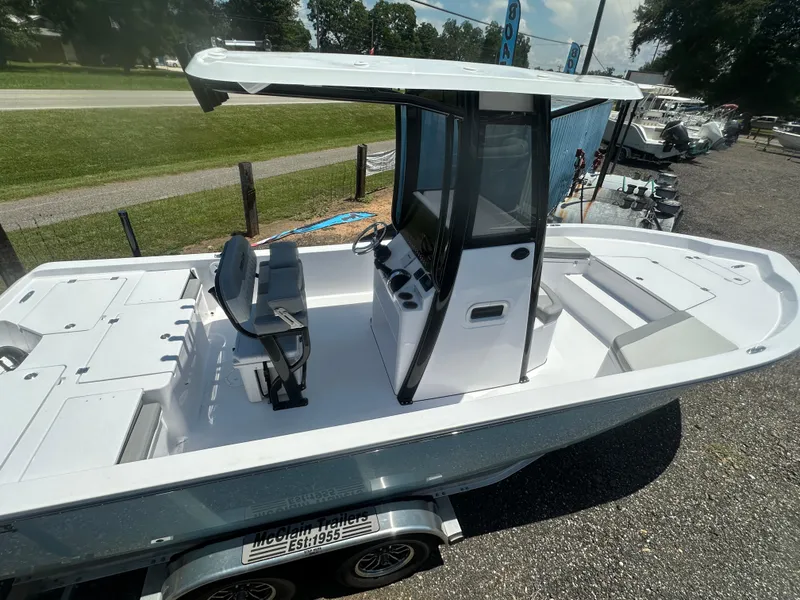 Slide: The Image of 2026 Action Craft 24 Bay boat on trailer, featuring spacious deck and modern console. - 12