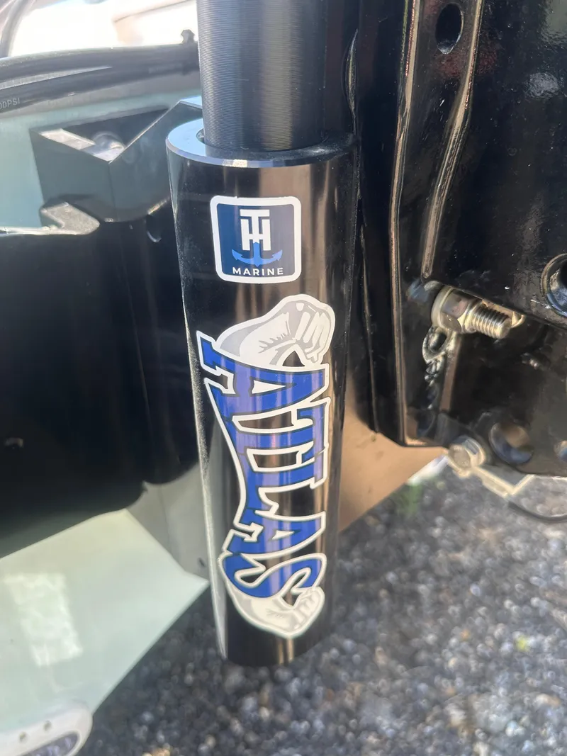 Slide: The Image of Close-up of Atlas hydraulic jack plate on Action Craft 24 Bay, 2026 model. - 15